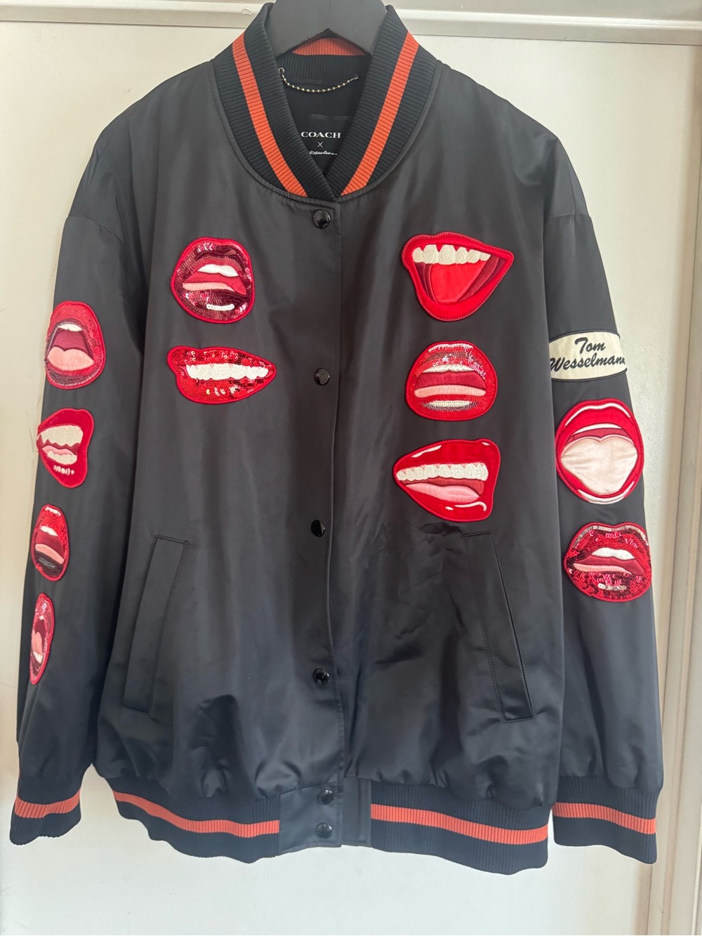 Coach Black Bomber Jacket with Red Lip Appliqués